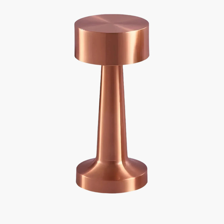 Copper-colored metal tamper with a cylindrical handle and flat circular base.