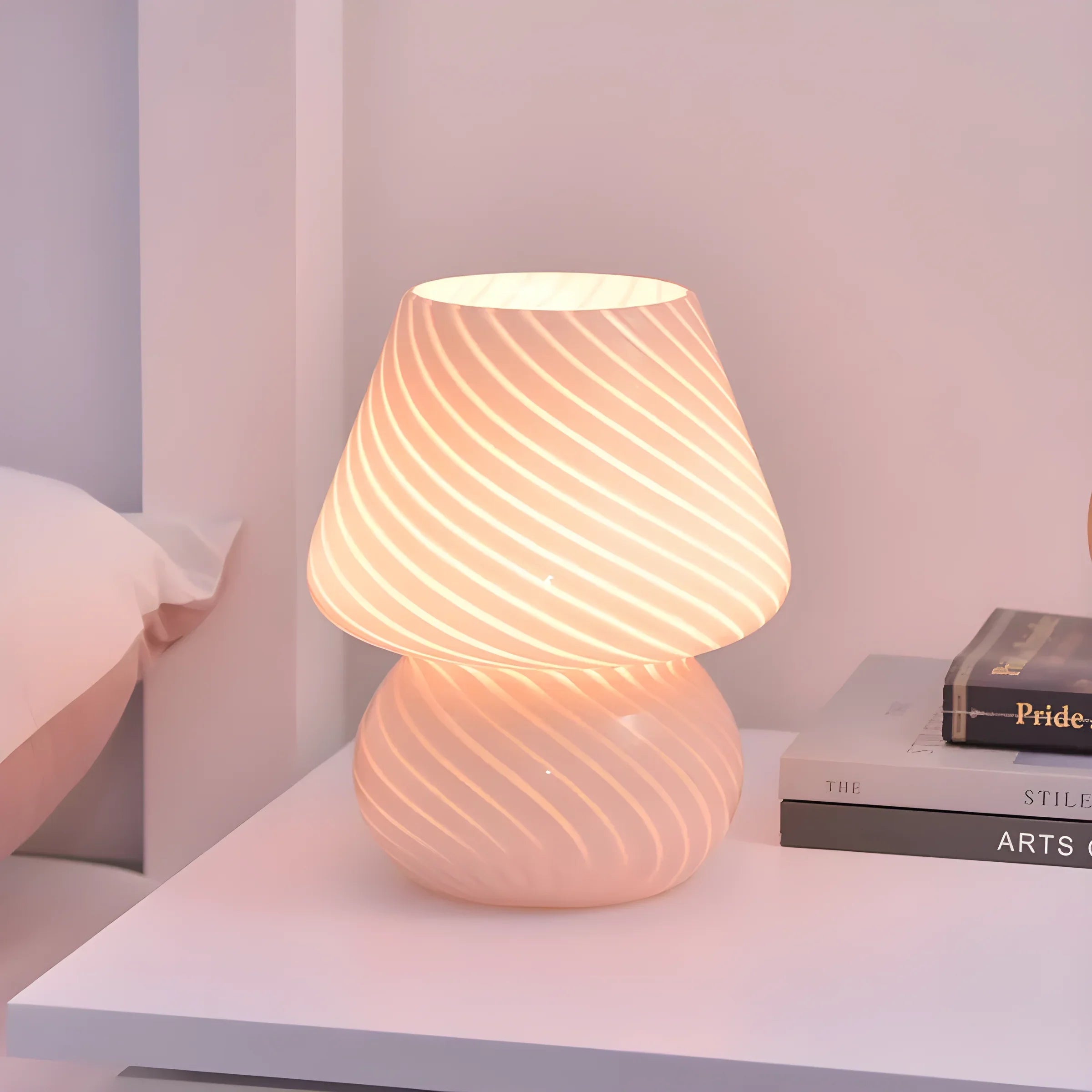 Glowing mushroom-shaped table lamp with a swirled pattern.