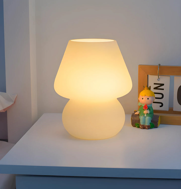 Glowing mushroom-shaped table lamp with a warm, diffused light.