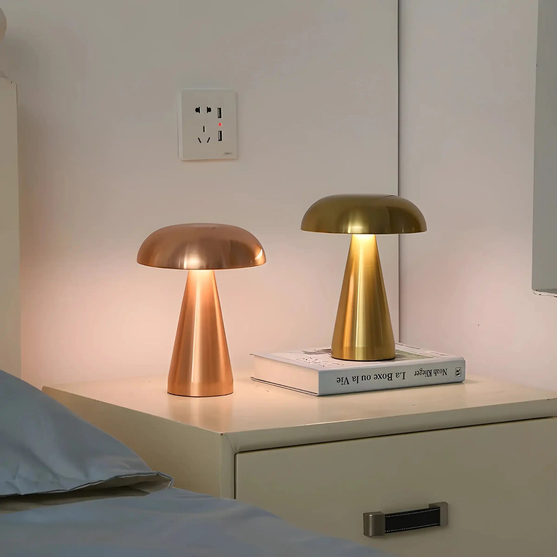 Pair of modern mushroom-shaped table lamps with metallic finishes.