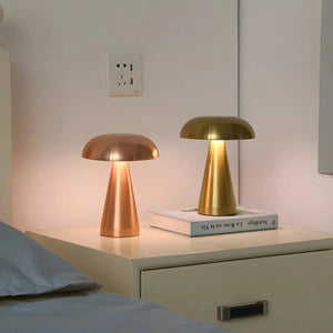 Pair of modern mushroom-shaped table lamps with metallic finishes.