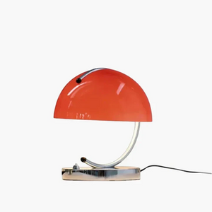 Red dome-shaped desk lamp with a curved metal stand.