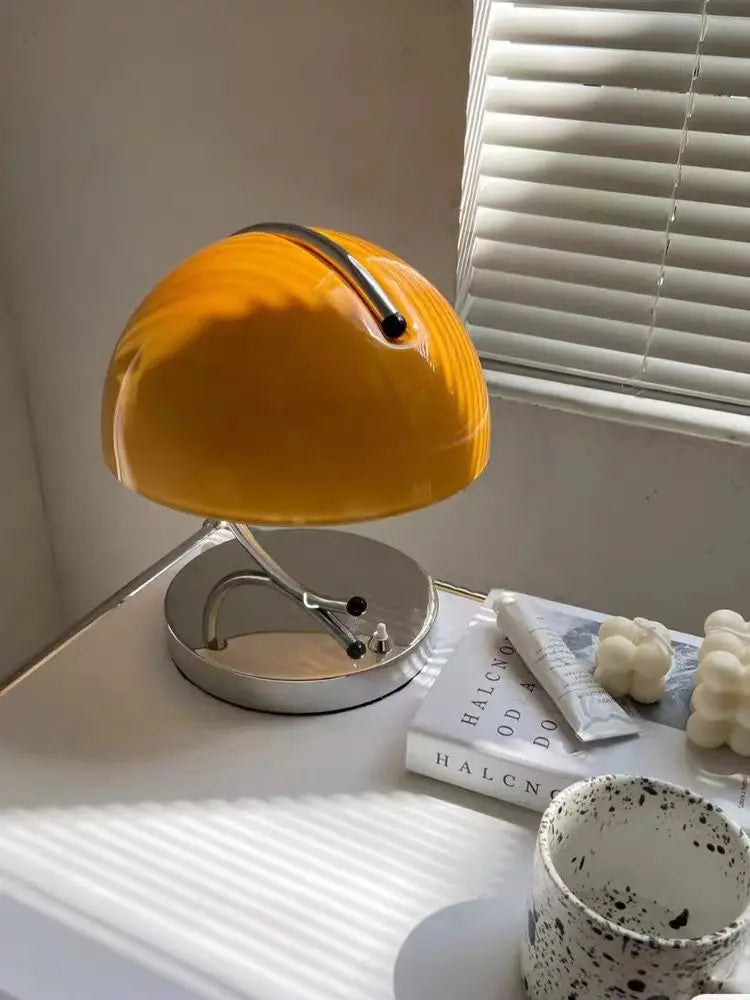 Retro-style yellow desk lamp with a dome-shaped shade.