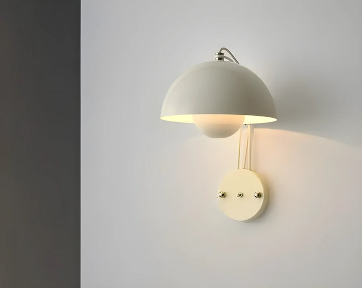 Wall-mounted lamp with a dome-shaped shade.