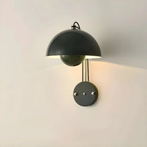 Wall-mounted lamp with a dome-shaped shade in dark green or black.