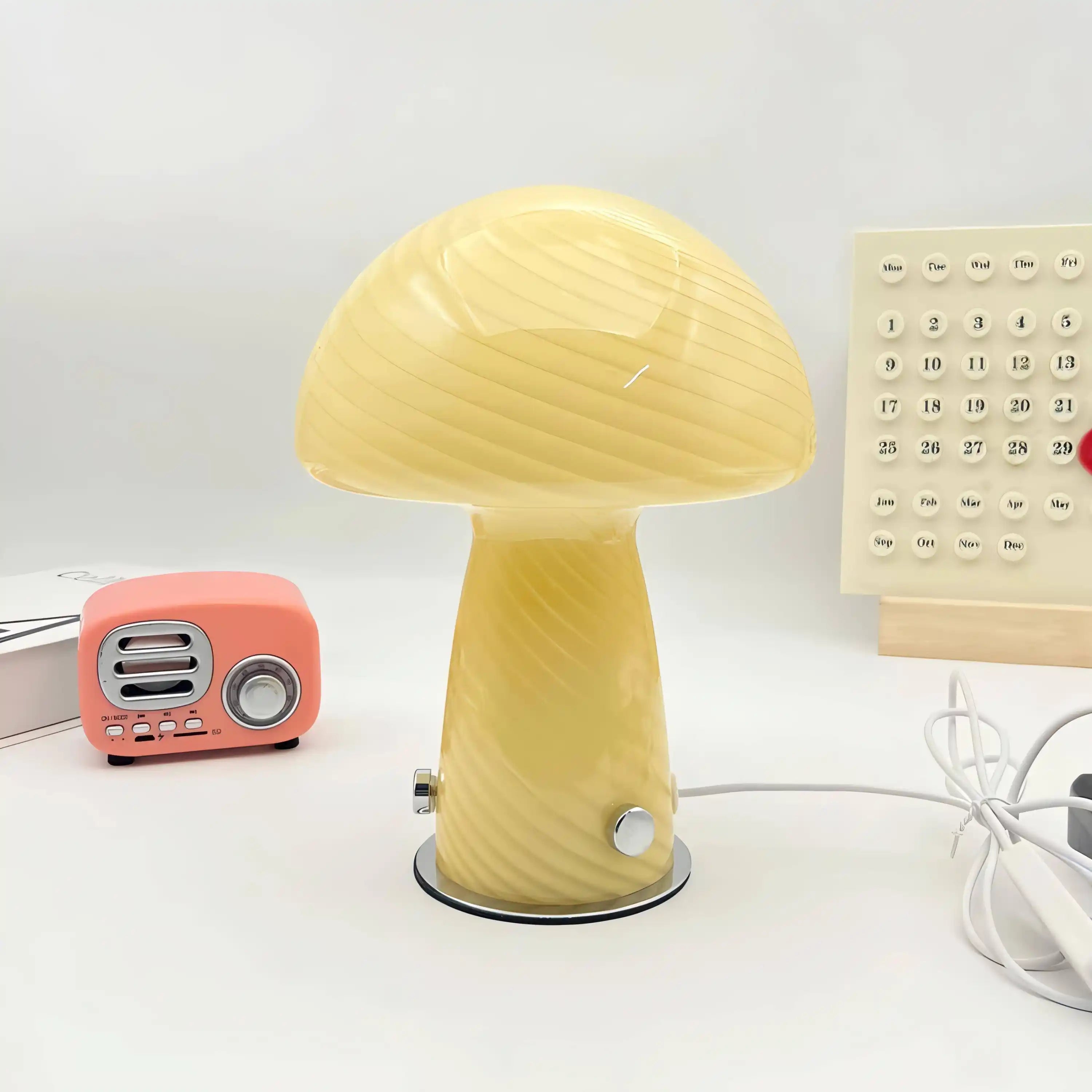 Yellow mushroom-shaped lamp with a rounded cap and stem-like base.